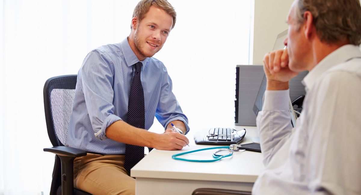 A doctor talking to his patient