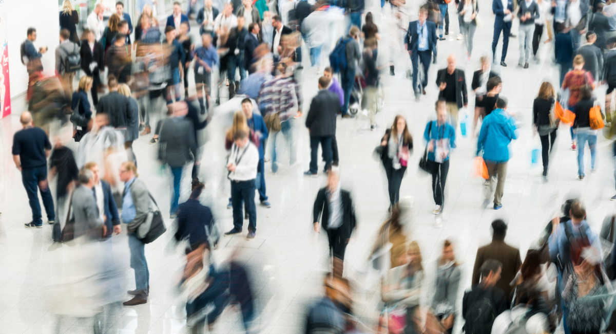 A crowd of people walking with indistinguishable faces