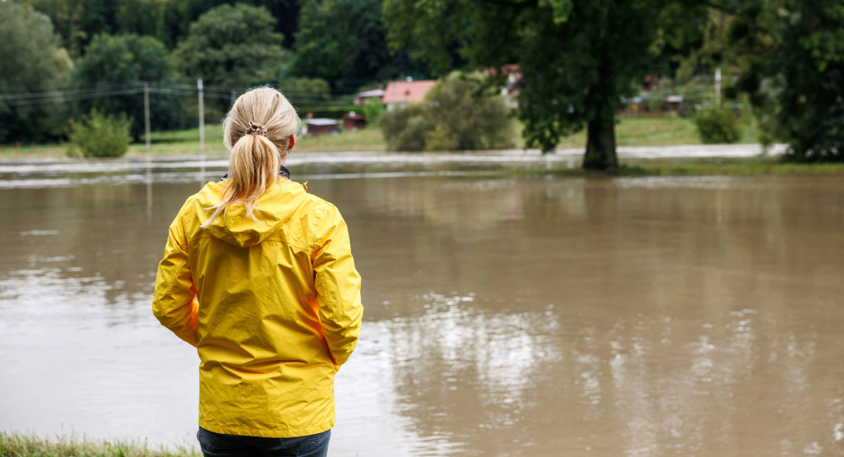 A woman looking out over flood water