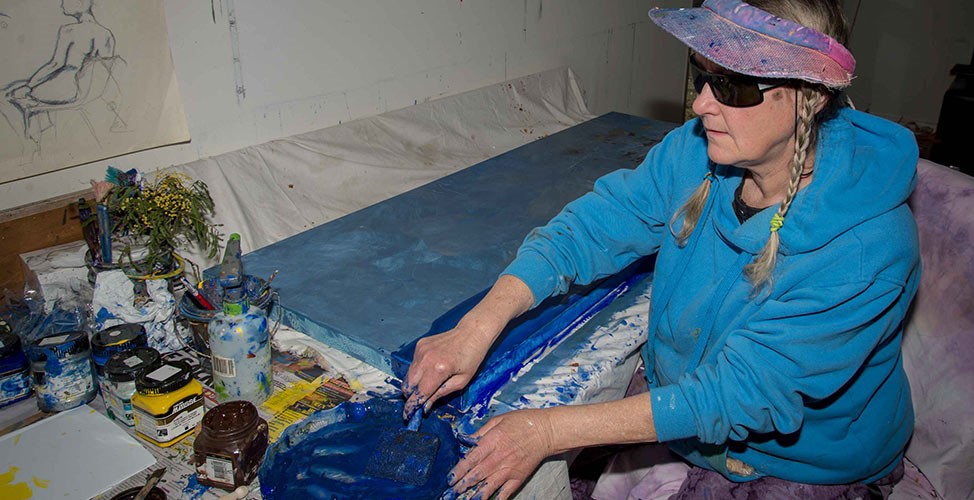 Artist Susan Oxenham, who is visually impaired, and some of her paintings that formed a large piece of work entitled Seasons of the Senses. Susan was recently selected by the Bundanon Trust as an artist-in-residence.