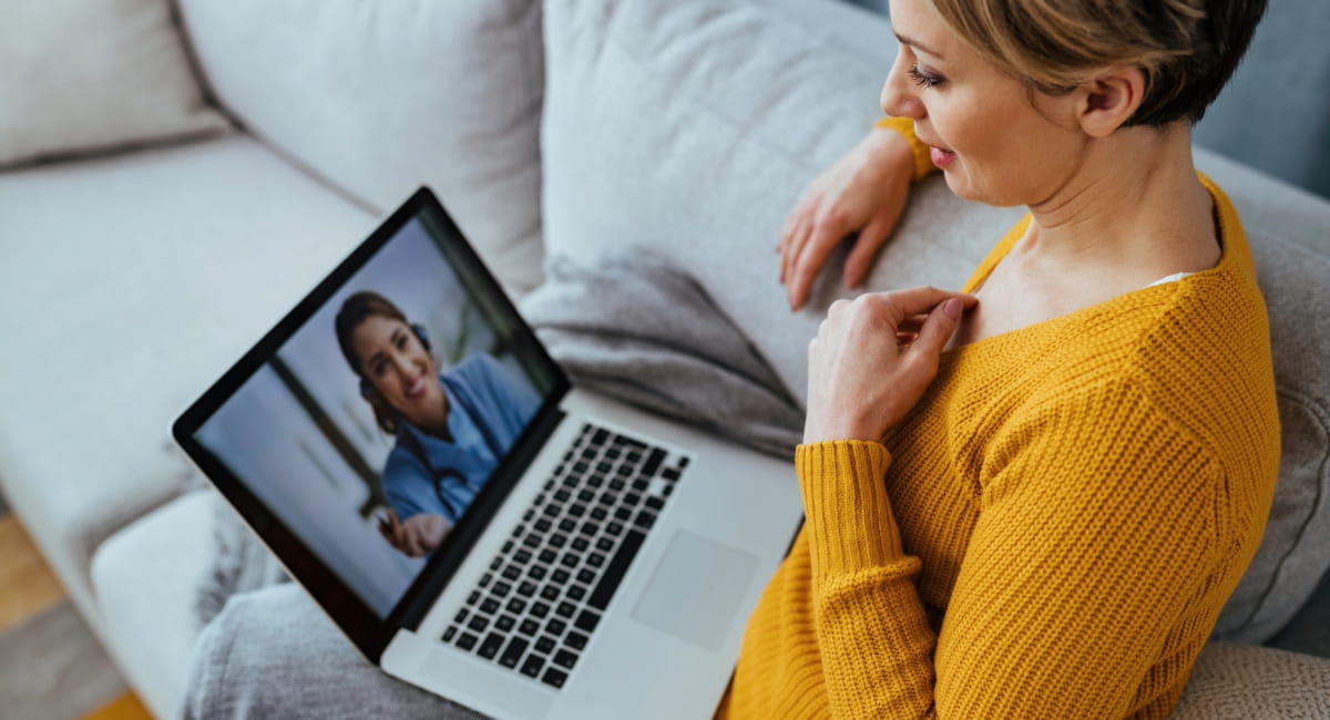 A woman on a telehealth appointment with a doctor